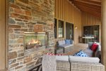 Incredible outdoor deck complete with a gas fireplace, BBQ grill, and soft seating.  